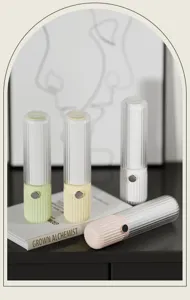 Detail shot of portable lint roller in pastel colors, capsule design, compact for travel use.