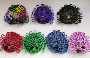 Portable outdoor travel elastic clothesline with multiple windproof clips in assorted colors.