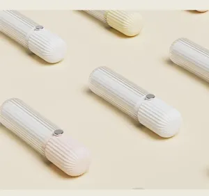 Close-up detail view of portable striped lint roller, modern design for daily clothes care.
