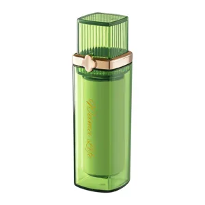 Portable lint roller with green translucent case and gold clover design for clothes dust removal.
