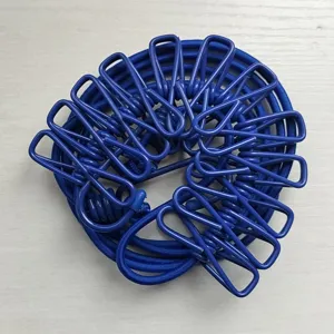 Detail view of the blue portable elastic clothesline with windproof clips for outdoor drying.