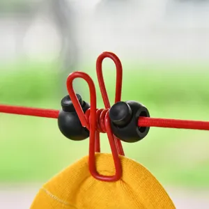 Outdoor elastic clothesline with anti-slip positioning beads and windproof clips for drying clothes.