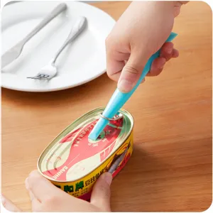 Multifunctional can opener and crevice cleaning scraper tool for daily household kitchen use.