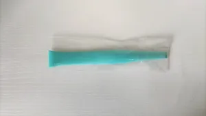 Detailed view of the multi-functional kitchen gap cleaning scraper tool in protective film.