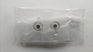 Detail shot of punch-free transparent adhesive wall hook with screw for hanging frames and items.