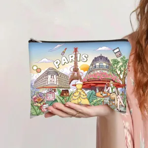 Vintage Paris themed illustration makeup bag held in hand showing the compact size