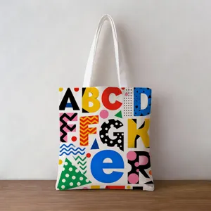 Retro canvas tote bag featuring colorful geometric alphabet pattern and sturdy handles
