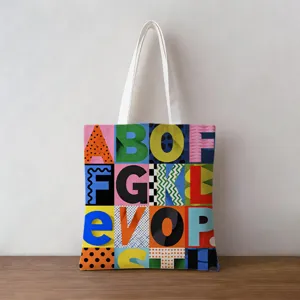 Close-up of vibrant pop art alphabet pattern on durable canvas tote bag