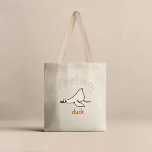 Detalle de bolsa de lona con pato de dibujos animados minimalista y texto