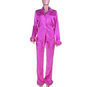 Pink satin pajama set with fluffy feather cuffs, lapel collar long sleeve top and pants.
