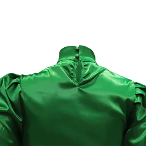 Close-up of green satin high collar blouse back detail with puff sleeves and buttons.