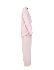 Side detail view of casual loose pink blazer and pants two-piece set, soft fabric.