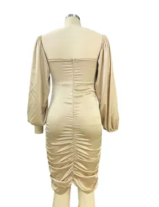 Back view of champagne long sleeve ruched midi dress, fitted silhouette, elegant style detail.