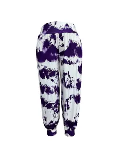 Tie-dye casual trousers detail featuring a purple and white pattern, high waist and tapered cuffs.