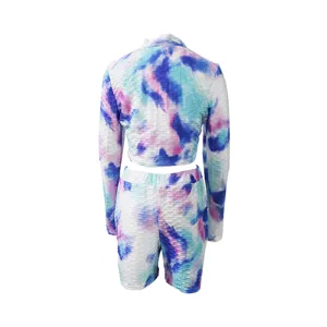 Back view detail of tie dye long sleeve crop top and biker shorts activewear two piece set.