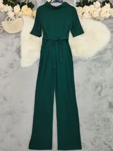 Elegant dark green lapel half-sleeve wide-leg jumpsuit for women, perfect for spring chic.