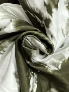Detailed view of military green and white tie-dye fabric texture, soft and comfortable material.