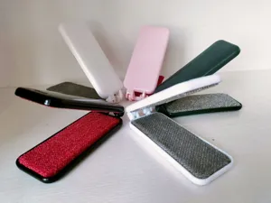 Portable folding double-sided lint remover for clothes, compact pet hair removal brush.