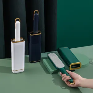 Household electrostatic lint remover brush set with base and gold trim for clothes cleaning.
