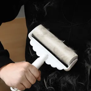 Long handle lint roller for clothes, effective sticky hair remover and dust brush cleaning tool.