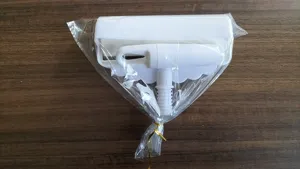 Lint roller replacement part detail view, white plastic component for daily cleaning use.