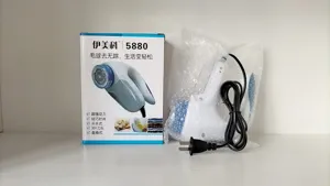 Detail shot showing the 5880 electric fabric shaver, packaging box, and power cord.