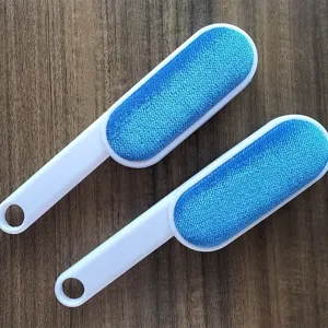 Double-sided lint remover brush for clothes and furniture cleaning, blue and white design.