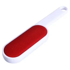 Double-sided electrostatic lint remover brush for clothes, durable ABS and fabric design.