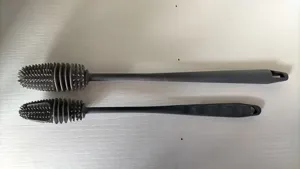 Detailed view of long handle silicone cup brush set for deep cleaning bottles and glassware.
