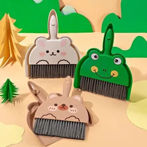 Mini desktop broom and dustpan set with animal design, ideal for cleaning desks.