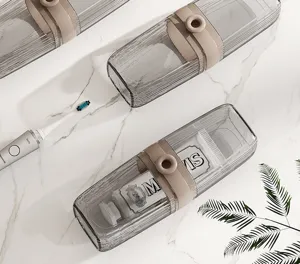 Detailed view of transparent ribbed travel toothbrush storage case with stylish beige strap.