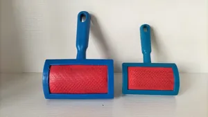 Detailed view of blue and red pet slicker brushes for cats and dogs grooming tool.
