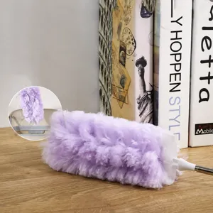 Disposable electrostatic duster with telescopic handle for home cleaning and hair removal.