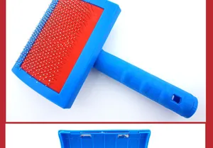 Close-up view of the blue pet slicker brush with fine stainless steel pins for cat and dog grooming.
