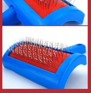 Pet slicker brush detail view, blue plastic handle with stainless steel pins for grooming cats and dogs.