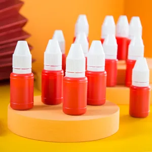Small plastic bottles with white caps, ideal for stamp ink and craft liquid storage use daily.