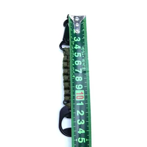Detailed view of army green paracord keychain with carabiner and bottle opener buckle.