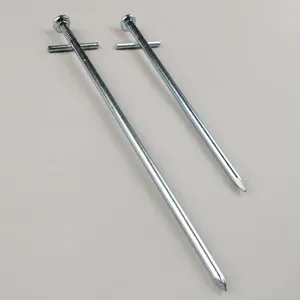 Close-up detail of zinc alloy cross tent peg, durable metal hardware for outdoor camping canopy.