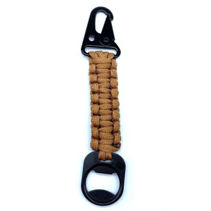 Durable outdoor paracord keychain detail with black carabiner clip and handy bottle opener.