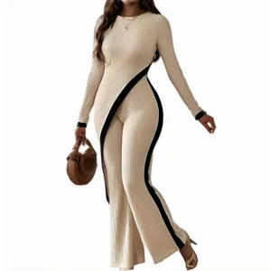 Detailed view of stylish ribbed knit long-sleeve jumpsuit featuring a chic black diagonal stripe.