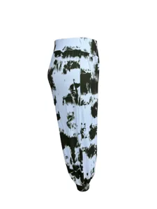 Detail view of women casual tie-dye print long harem pants with high waist and cuffed ankles.
