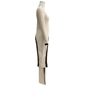 Side detail of women's casual long sleeve top and pants two piece set in beige rib knit.