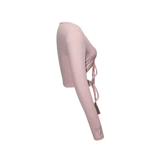 Side view detail of women pink ribbed long sleeve crop top with stylish front drawstring.