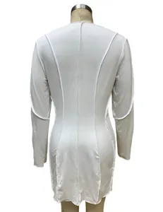 Back detail of white long sleeve bodycon dress showing exposed seam design and slim fit.