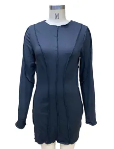 Black long sleeve mini dress featuring exposed seam design, sleek fit, and modern silhouette.