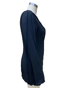 Side detail view of the elegant black long sleeve bodycon dress, showing slim fit cut.
