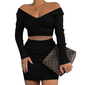 Stylish black ribbed off-shoulder long sleeve crop top and matching mini skirt two-piece set.