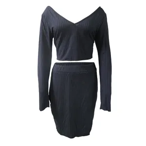 Black ribbed long sleeve crop top and skirt two piece set detail view, chic outfit.