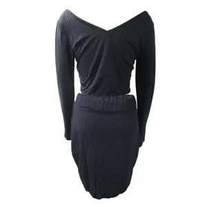 Black ribbed long sleeve knit top and skirt set detail view, showing soft texture and fit.