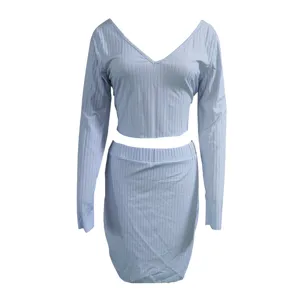 Light blue ribbed knit two-piece set detail, featuring V-neck long sleeve top and skirt.